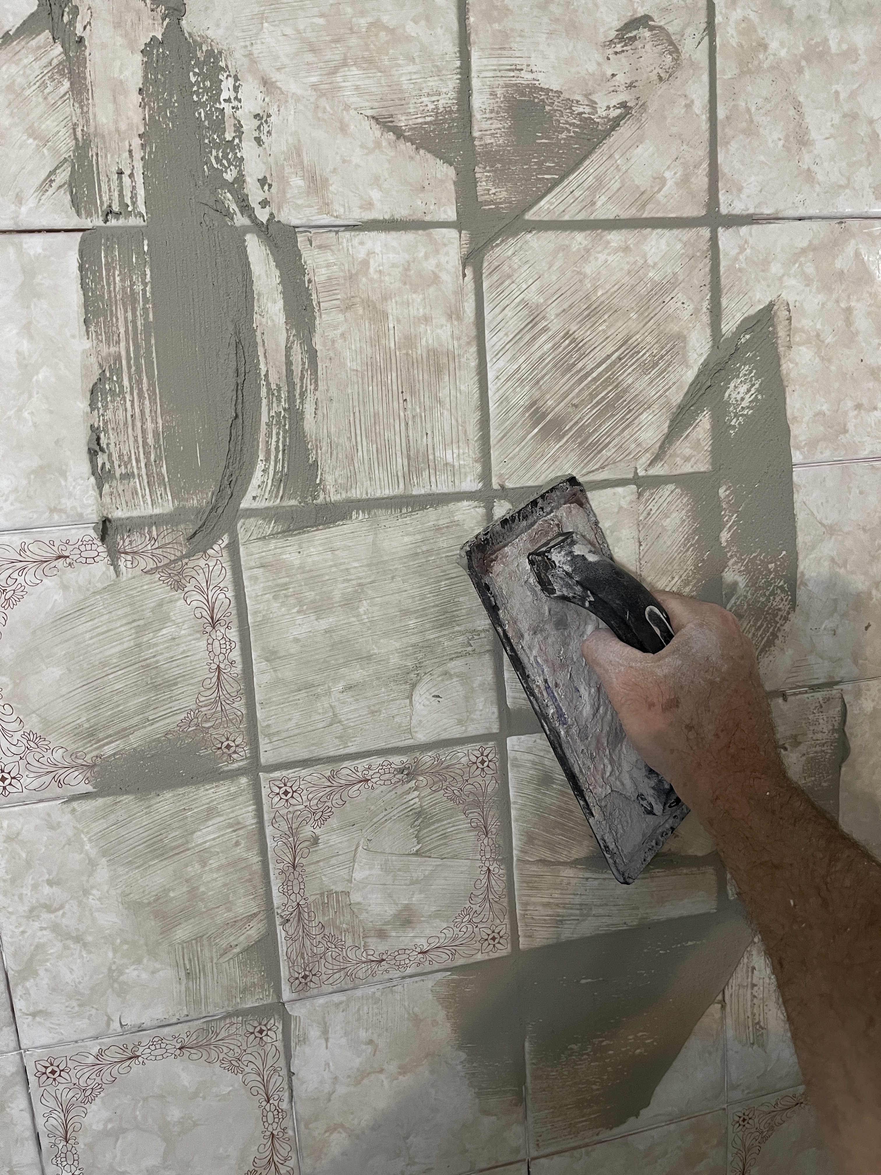 Re-grouting bathtub tile